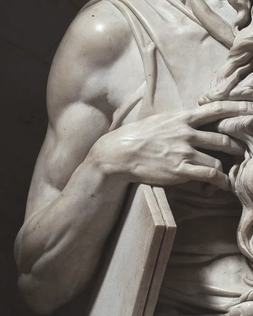 Detail of Moses’ right arm and hand, the tablets of the law beneath it and the beard falling beside