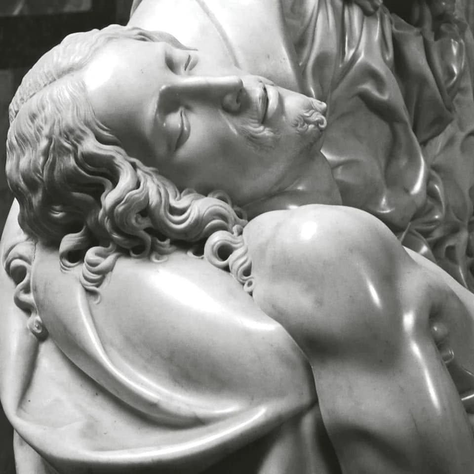 Detail of the dead Christ’s face, eyes closed, resting on the Virgin’s shoulder